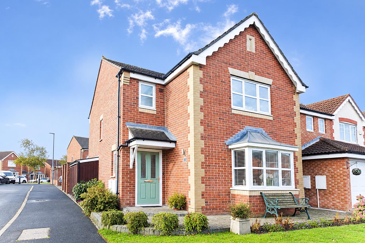 Sunlit Red-Brick Corner House.png